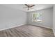 Spacious bedroom featuring luxury vinyl flooring and natural light at 3540 Owl Brow Ct, Cumming, GA 30028