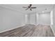 Spacious bedroom with luxury vinyl flooring, ceiling fan, and ample light at 3540 Owl Brow Ct, Cumming, GA 30028