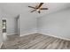 Large bedroom with luxury vinyl flooring, neutral paint, and ample light at 3540 Owl Brow Ct, Cumming, GA 30028