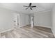 Bright bedroom with hardwood floors, tray ceilings, and recessed lights at 3540 Owl Brow Ct, Cumming, GA 30028