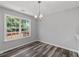 Bright dining area with a large window that offers a beautiful view of the outdoor deck at 3540 Owl Brow Ct, Cumming, GA 30028