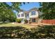 Delightful two-story residence with a well-kept lawn, mature trees, and quaint curb appeal at 3540 Owl Brow Ct, Cumming, GA 30028