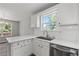 Modern kitchen with stainless steel dishwasher, undermount sink, and white countertops at 3540 Owl Brow Ct, Cumming, GA 30028