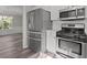 Kitchen area with stainless steel refrigerator and oven at 3540 Owl Brow Ct, Cumming, GA 30028