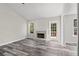 Bright living room with fireplace, access to outdoor deck, and fresh interior paint at 3540 Owl Brow Ct, Cumming, GA 30028