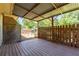 Spacious covered patio with a wooden fence, great for outdoor entertaining at 3540 Owl Brow Ct, Cumming, GA 30028