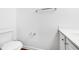 Clean half bathroom featuring a white toilet, vanity, and modern fixtures at 3987 Howell Park Rd, Duluth, GA 30096