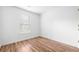 Bedroom featuring hardwood floors and a window providing natural light at 3987 Howell Park Rd, Duluth, GA 30096