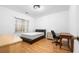 Comfortable bedroom with hardwood floors, window, and a minimalist aesthetic at 3987 Howell Park Rd, Duluth, GA 30096
