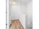 Bright hallway with hardwood flooring leads to other rooms at 3987 Howell Park Rd, Duluth, GA 30096
