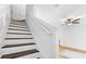 Staircase featuring wood treads and white risers and banister at 3987 Howell Park Rd, Duluth, GA 30096