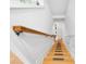 Bright wooden staircase with a white trim and painted white walls at 3987 Howell Park Rd, Duluth, GA 30096