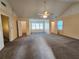 Spacious bedroom with vaulted ceilings, carpet flooring, fan, and multiple windows providing natural light at 2875 Oak Meadow Dr, Snellville, GA 30078