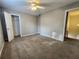 Bedroom with carpeted floors, standard closet and a stairway access point to another room at 2875 Oak Meadow Dr, Snellville, GA 30078