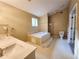 Spacious main bathroom with a garden tub, separate shower, and double sink vanity at 2875 Oak Meadow Dr, Snellville, GA 30078