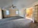 Large main bedroom featuring vaulted ceilings, carpet, and doors to the bathroom at 2875 Oak Meadow Dr, Snellville, GA 30078