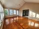 Bright sunroom with hardwood floors, multiple windows, vaulted ceilings, and a ceiling fan at 2875 Oak Meadow Dr, Snellville, GA 30078