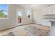 Breakfast nook featuring a glass door to the deck, granite countertops, and white cabinetry at 2990 Fareed St, Douglasville, GA 30135