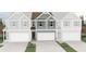 Charming new construction townhome featuring a two-car garage and inviting exterior design at 6365 Towhee Way, Morrow, GA 30260