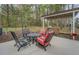 Backyard patio with table, chairs, and outdoor kitchen at 135 Clear Spring Lane, Oxford, GA 30054
