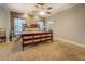 Primary bedroom with a large bed, carpeted floors, and neutral decor at 135 Clear Spring Lane, Oxford, GA 30054