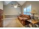 Bedroom with neutral colors, a comfortable sofa, and natural lighting at 135 Clear Spring Lane, Oxford, GA 30054