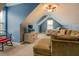Large bonus room with sloped ceiling, sofa, TV, and bed at 135 Clear Spring Lane, Oxford, GA 30054