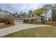 Attractive home with a spacious driveway and a two-car garage with beautiful lawn at 135 Clear Spring Lane, Oxford, GA 30054