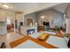 Open concept kitchen with stainless steel appliances and a view of the living room at 135 Clear Spring Lane, Oxford, GA 30054