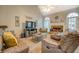 Comfortable living room with vaulted ceilings, fireplace, and plush seating area at 135 Clear Spring Lane, Oxford, GA 30054