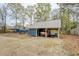 Outbuilding with an attached carport area, ideal for equipment storage at 135 Clear Spring Lane, Oxford, GA 30054
