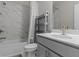 Bathroom with marble tile, neutral colors, vanity, and combination bathtub and shower at 4651 Eddibunn Se Dr, Smyrna, GA 30080