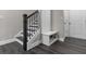 Entryway featuring a bench, a coat rack, and access to the stairs at 4651 Eddibunn Se Dr, Smyrna, GA 30080