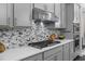 Beautiful kitchen featuring a quartz countertop, modern cabinetry, and stainless steel appliances at 4651 Eddibunn Se Dr, Smyrna, GA 30080