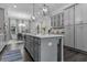 Spacious kitchen with a large island, pendant lighting, and stainless steel appliances at 4651 Eddibunn Se Dr, Smyrna, GA 30080