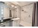 Updated bathroom offers a sink, granite counters, shower and tub combo, plus neutral paint at 750 Park Ne Ave # 18S, Atlanta, GA 30326