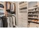 This organized closet has many shirts, pants, shoes, and drawers for storing clothes at 750 Park Ne Ave # 18S, Atlanta, GA 30326