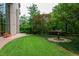 Beautifully landscaped courtyard with lush greenery and a unique bird bath fountain at 750 Park Ne Ave # 18S, Atlanta, GA 30326