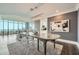 Bright dining area featuring hardwood floors, a modern chandelier, and comfortable seating near large windows at 750 Park Ne Ave # 18S, Atlanta, GA 30326