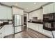 Modern kitchen with stainless steel appliances, granite counters, and bright lighting at 750 Park Ne Ave # 18S, Atlanta, GA 30326