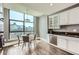 Bright breakfast nook featuring city views, modern lighting, and stainless steel appliances at 750 Park Ne Ave # 18S, Atlanta, GA 30326