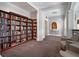 Cozy library with floor-to-ceiling bookshelves, comfortable seating, and warm lighting, creating a perfect reading nook at 750 Park Ne Ave # 18S, Atlanta, GA 30326