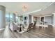 Open-concept living room with fireplace, hardwood floors and modern lighting at 750 Park Ne Ave # 18S, Atlanta, GA 30326