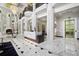 Grand lobby featuring marble floors, ornate columns, and a stylish reception desk, creating a luxurious entrance at 750 Park Ne Ave # 18S, Atlanta, GA 30326
