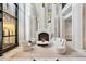 Elegant lobby featuring a fireplace, comfortable seating, and luxurious design, offering a welcoming ambiance at 750 Park Ne Ave # 18S, Atlanta, GA 30326