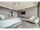 This is a comfortable main bedroom that features a large window, chair and sleek silver table at 750 Park Ne Ave # 18S, Atlanta, GA 30326