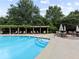 Inviting community pool with comfortable lounge chairs, surrounded by lush greenery, creating a serene oasis at 750 Park Ne Ave # 18S, Atlanta, GA 30326