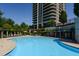 Beautiful community pool with a backdrop of high-rise buildings, offering a perfect spot for relaxation and leisure at 750 Park Ne Ave # 18S, Atlanta, GA 30326