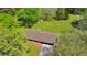 Aerial view of the home showcasing the large lot with mature trees and a well-maintained roof at 1955 Starr Sw Rd, Conyers, GA 30094