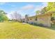 Lush backyard featuring mature landscaping and a cozy patio area, perfect for entertaining at 1955 Starr Sw Rd, Conyers, GA 30094